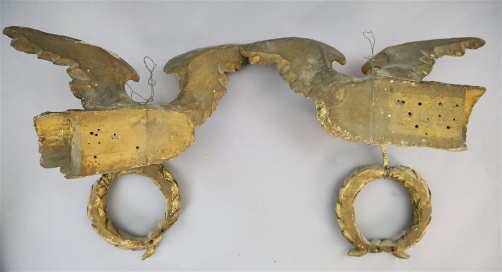 A pair of early 19th century carved giltwood and gesso wall appliqués, W.1ft 6in. H.1ft 6in.